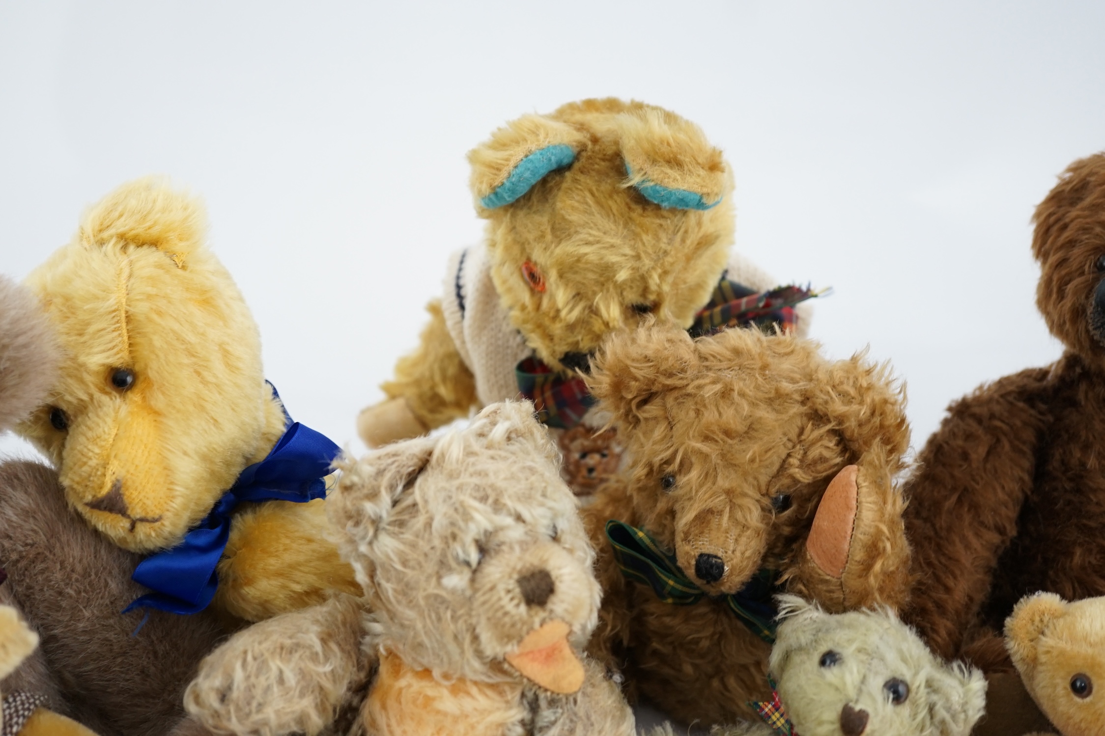 A collection of twenty-six modern teddy bears by The English Teddy Bear Co., Honey Hill Bears, Merrythought, Robin Rive, Steiff, etc.